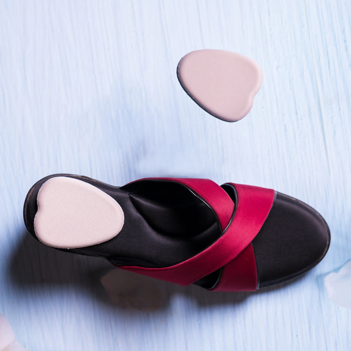 8ease Belle HighHeel heel pads for high heels, pad fitted in a red and black sandal