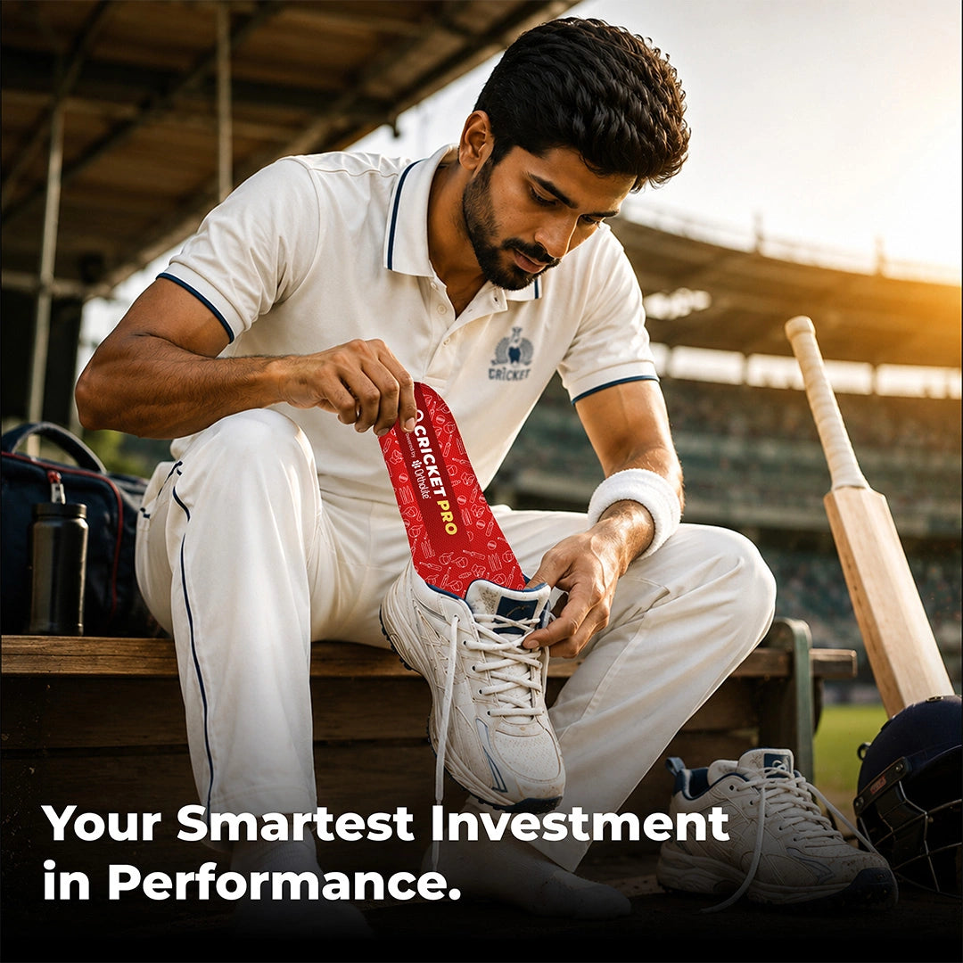 Cricketer lacing white cricket shoes fitted with Cricket Pro insoles in the dugout