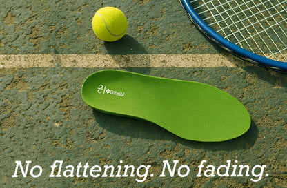 Green Ortholite insole on a tennis court beside a racket and ball, with text: 'No flattening. No fading.